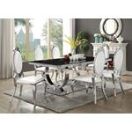 Antoine Chrome and Black Glass Dining Table 107871 by Coaster in room